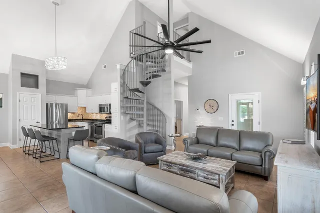 a living room with furniture and a clock