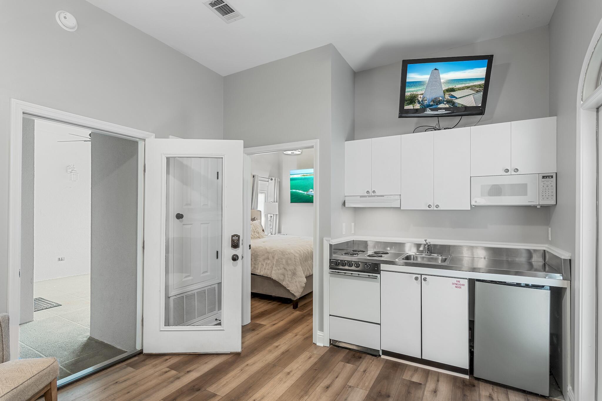 19 Diamond Cove Miramar Beach, FL 32550 - Photo 23 of 33 a kitchen with stainless steel appliances white cabinets and a refrigerator