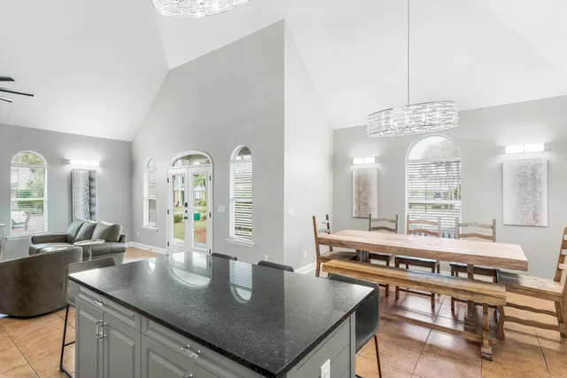 a large kitchen with a table and chairs
