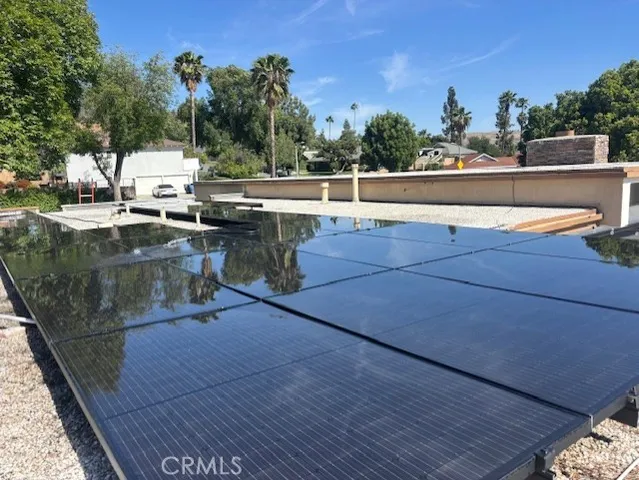 a view of a backyard with sitting area