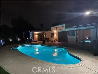 a view of a swimming pool with a patio