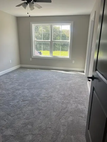 a bathroom with a toilet and a bath tub