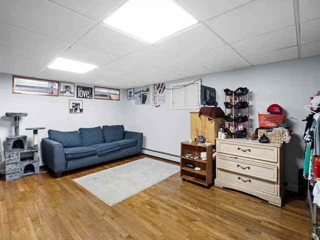 a bedroom with furniture and a dresser