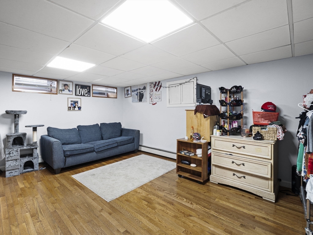 8 Clarks Court Lowell, MA 01852 - Photo 21 of 33 a bedroom with furniture and a dresser