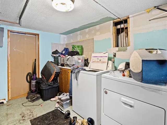 a work room with furniture and a window