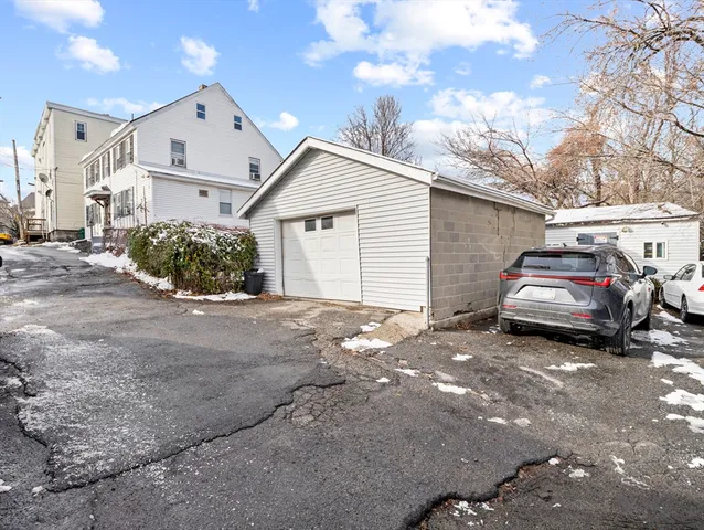 a view of a car parked in front of a house