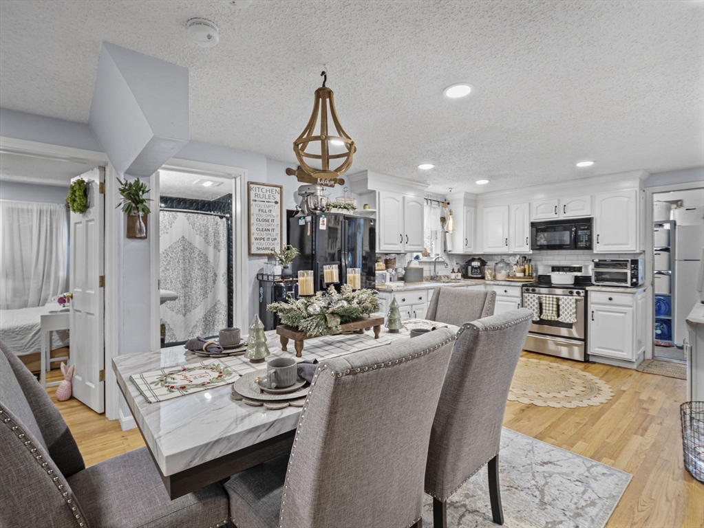 8 Clarks Court Lowell, MA 01852 - Photo 7 of 33 a view of a dining room and livingroom view