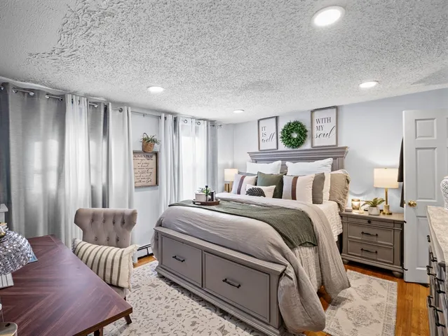 a bedroom with bed and a couch