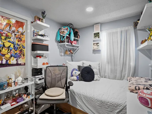 a bathroom with a sink a toilet and a shower curtain