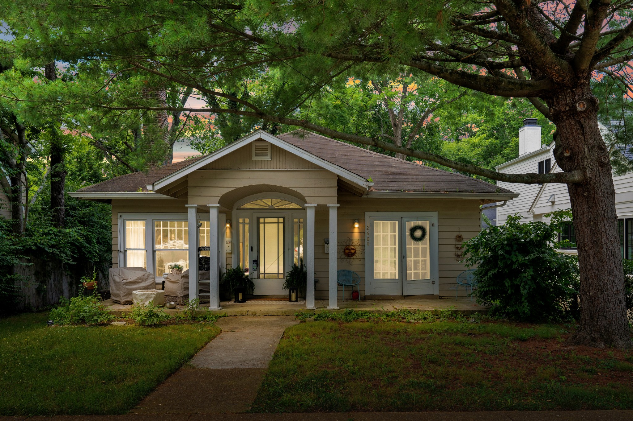 a front view of a house with a yard