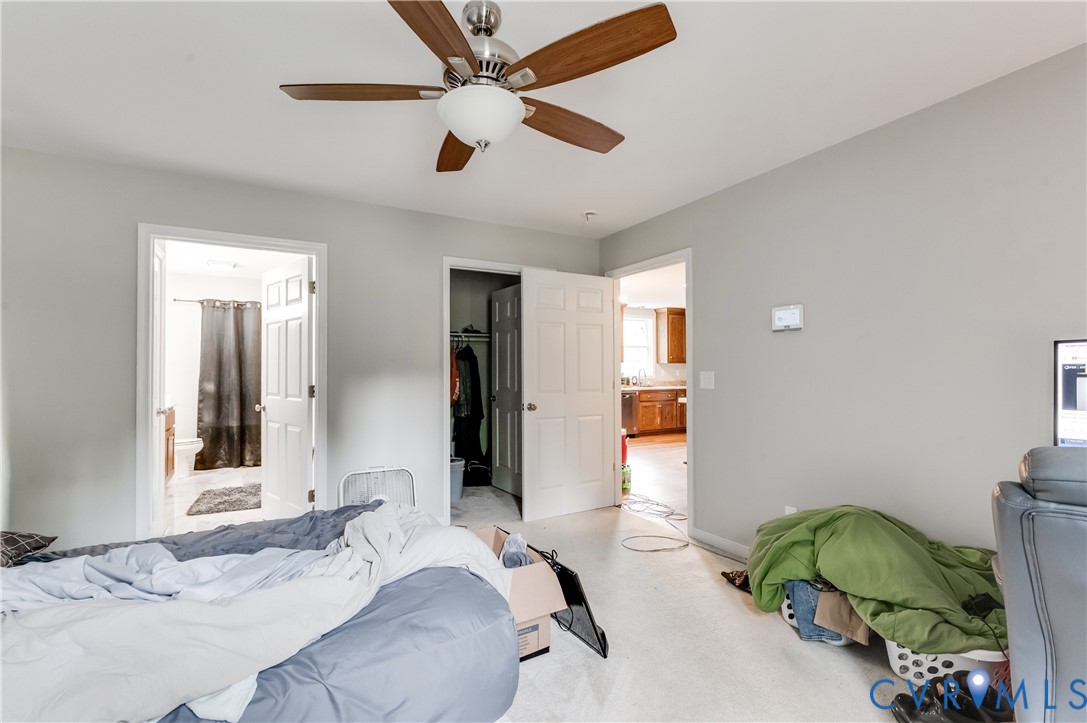 24580 St James Road Jetersville, VA 23083 - Photo 14 of 25 Carpeted room with a ceiling fan featuring wood-fi