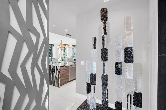 a view of a balcony with chairs and a floor to ceiling window