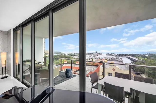 a kitchen that has a lot of cabinets and a wooden floor