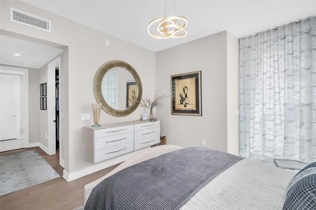 a living room with a fireplace furniture and a potted plant