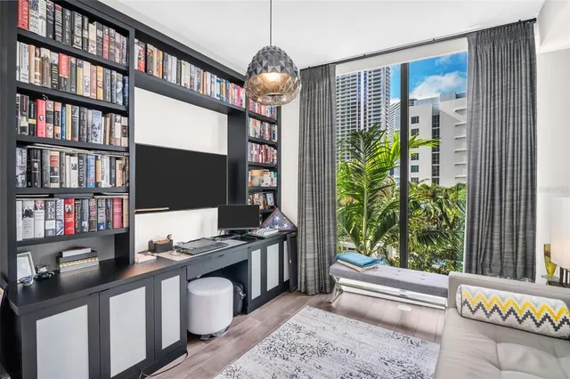 a view of swimming pool with outdoor seating and city view