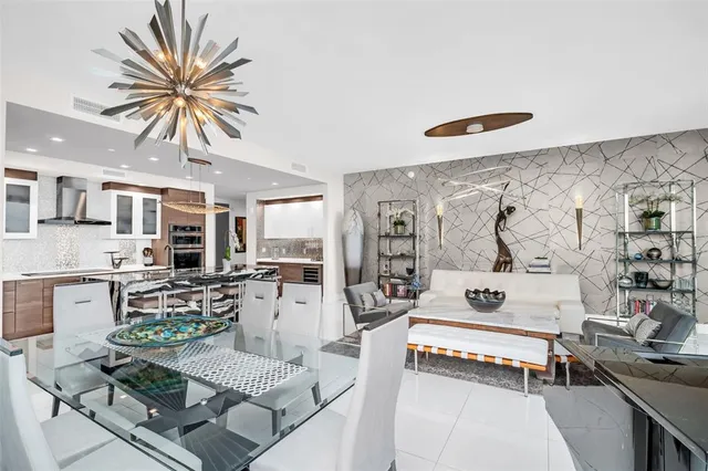 a kitchen with stainless steel appliances granite countertop a stove and a refrigerator