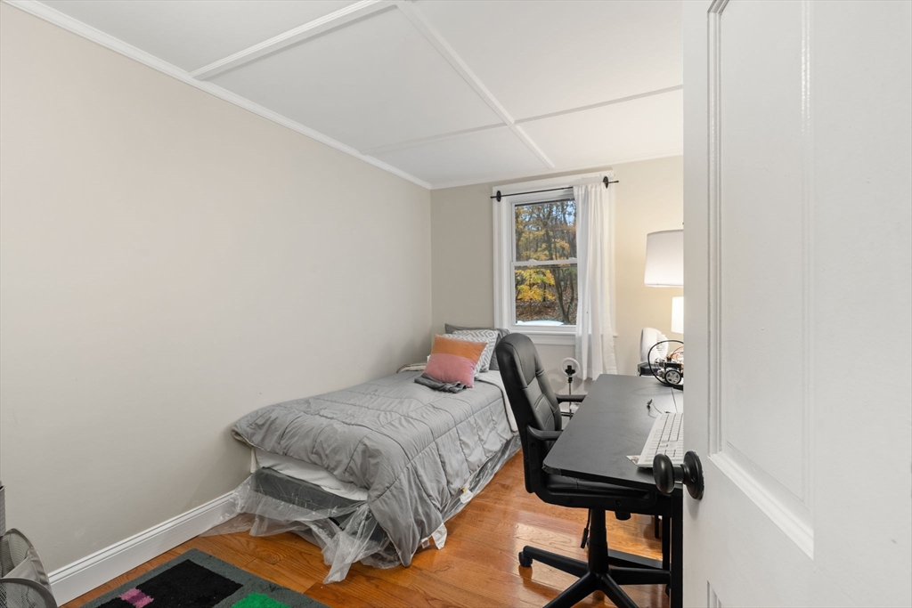 19 Cedar Street Beverly, MA 01915 - Photo 14 of 33 a bedroom with a bed and a window