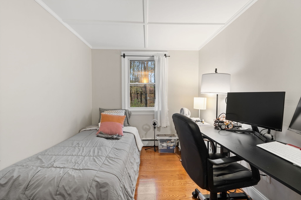 19 Cedar Street Beverly, MA 01915 - Photo 15 of 33 a bedroom with furniture and bed