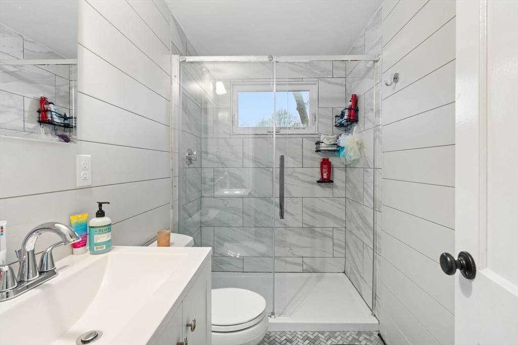19 Cedar Street Beverly, MA 01915 - Photo 17 of 33 a bathroom with a sink a toilet and shower