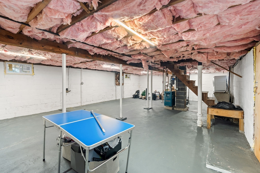 19 Cedar Street Beverly, MA 01915 - Photo 27 of 33 a roof deck with table and chairs