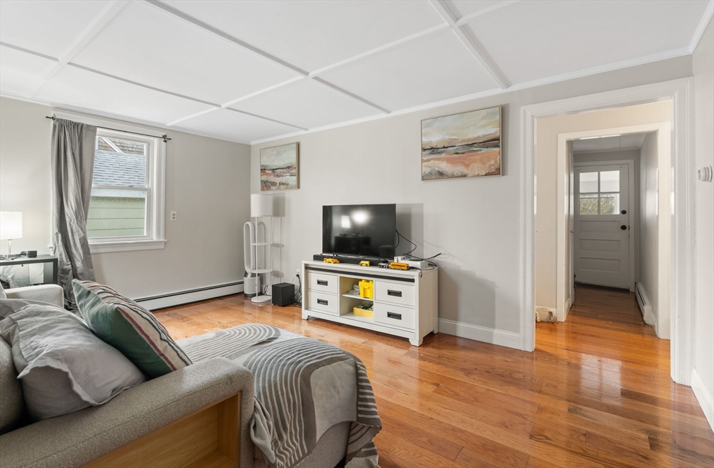19 Cedar Street Beverly, MA 01915 - Photo 6 of 33 a living room with furniture and a flat screen tv