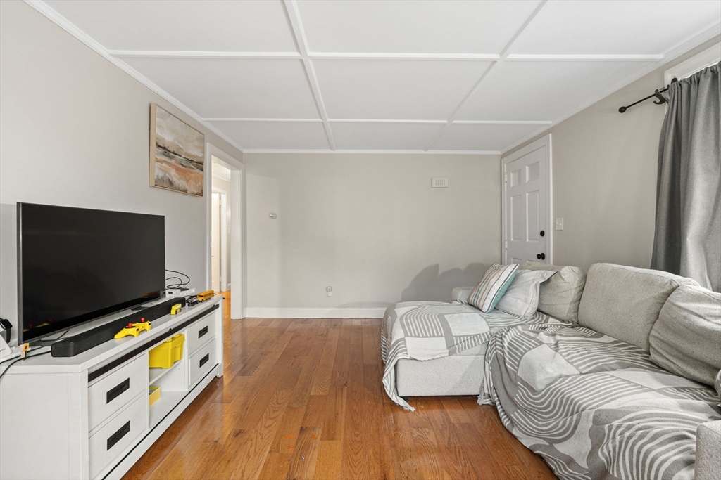 19 Cedar Street Beverly, MA 01915 - Photo 8 of 33 a living room with furniture and a flat screen tv