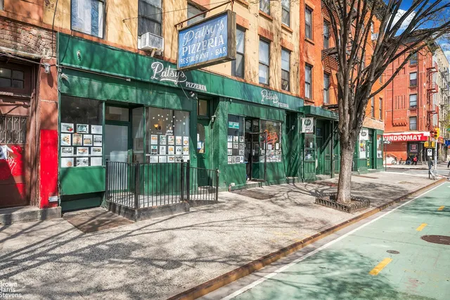 a living room with furniture a couch and large window