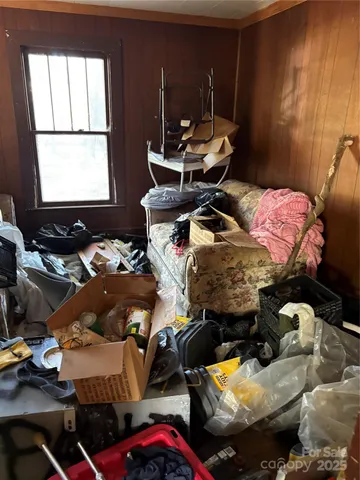 a bedroom with bed and a window