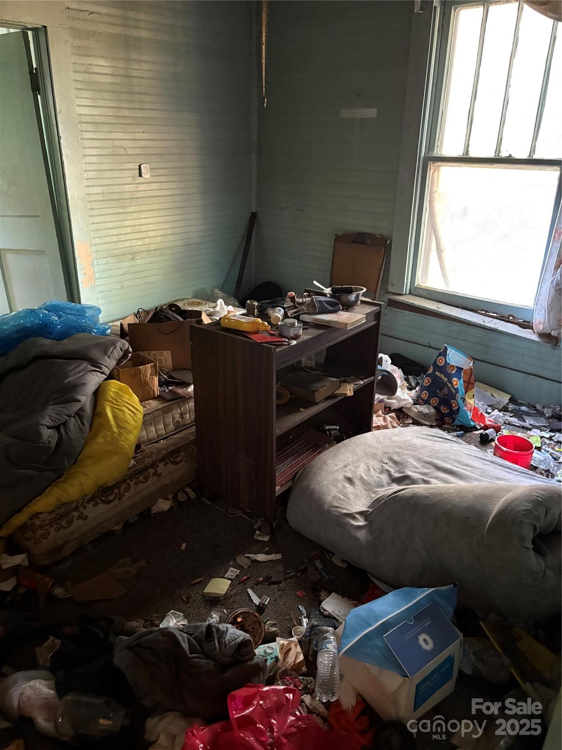131 Autumn Leaf Road Troutman, NC 28166 - Photo 5 of 6 a bedroom with a bed and a window