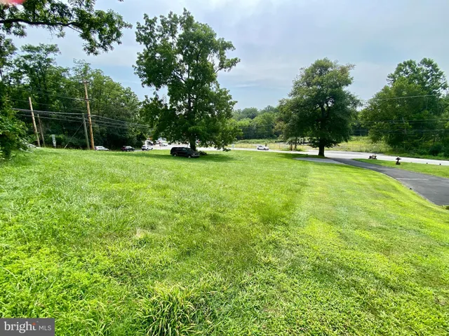 a view of a swimming pool with a yard