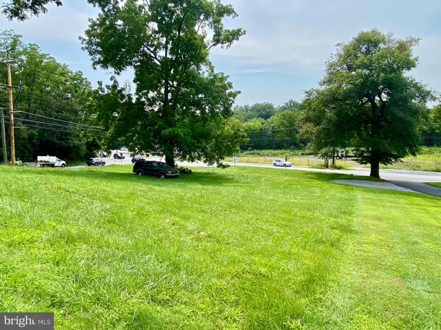 a view of field with trees in the background