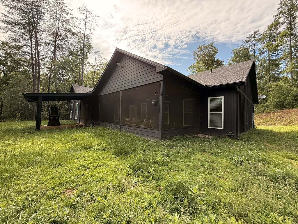 415 Autumn Ridge Drive Mineral Bluff, GA 30559 - Photo 20 of 21 a backyard of a house with lots of green space