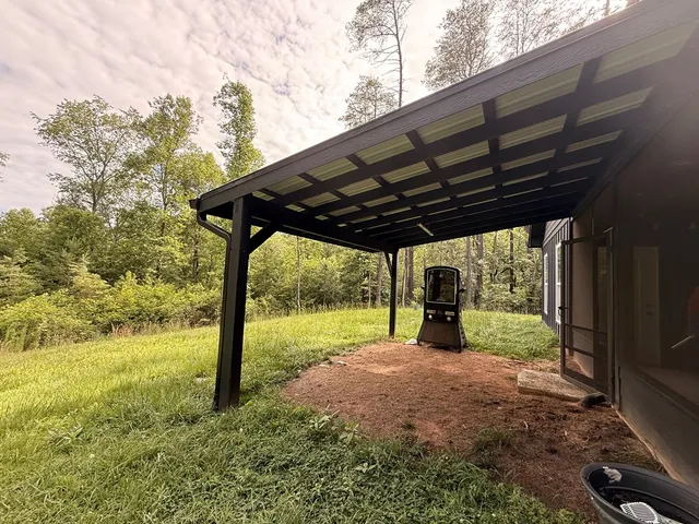 a view of a big yard with an outdoor space