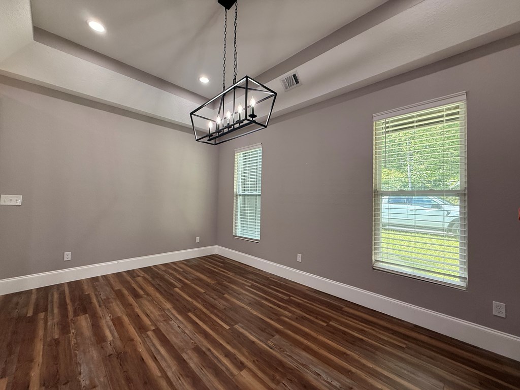 415 Autumn Ridge Drive Mineral Bluff, GA 30559 - Photo 10 of 21 a view of a room with wooden floor exposed radiator and a window