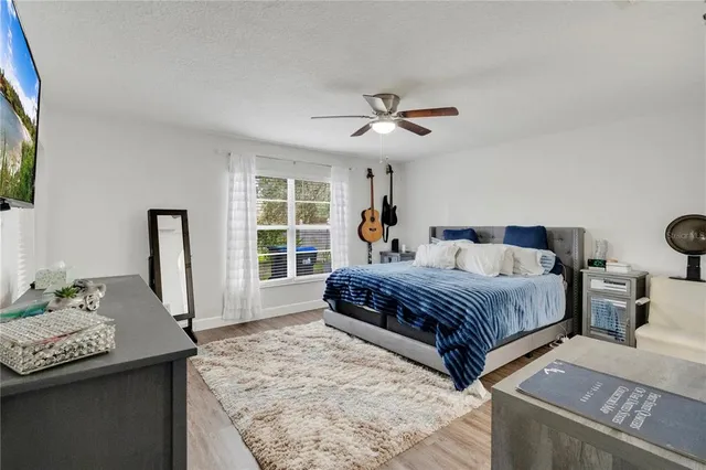 a bedroom with a bed and a window in it