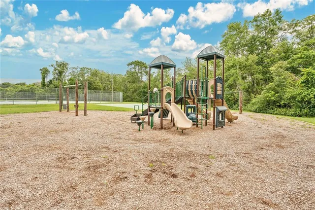 a view of a park with swings and slides