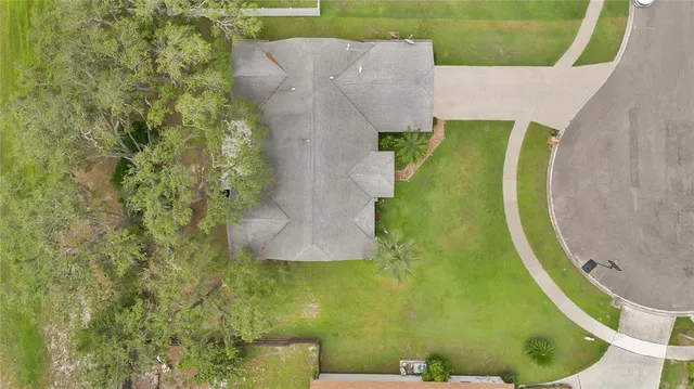 a view of a swimming pool with a yard