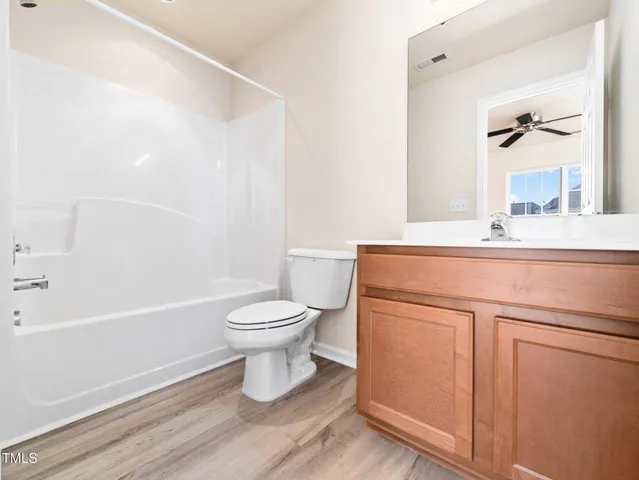 a bathroom with a sink a toilet and a bathtub