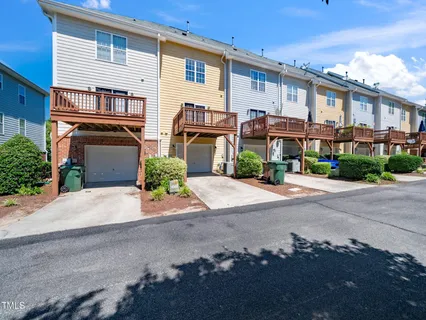 a front view of a house with a yard and a garage