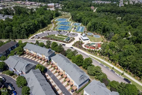 an aerial view of a residential house with a garden