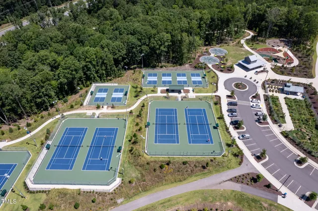 a aerial view of a house with a yard