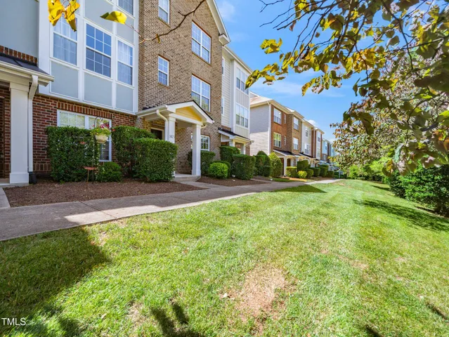 a view of a building with a yard