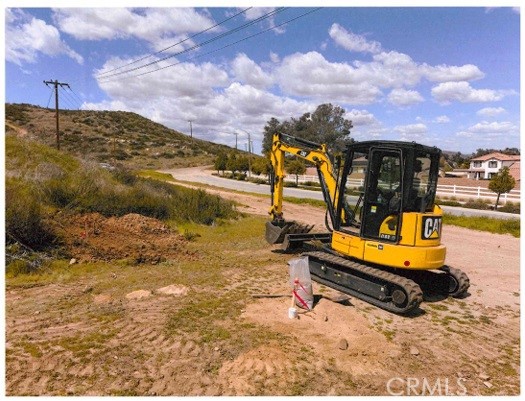 27277 Garbani Road Menifee, CA 92584 - Photo 18 of 21 a view of a swimming pool with a yard and a fire pit