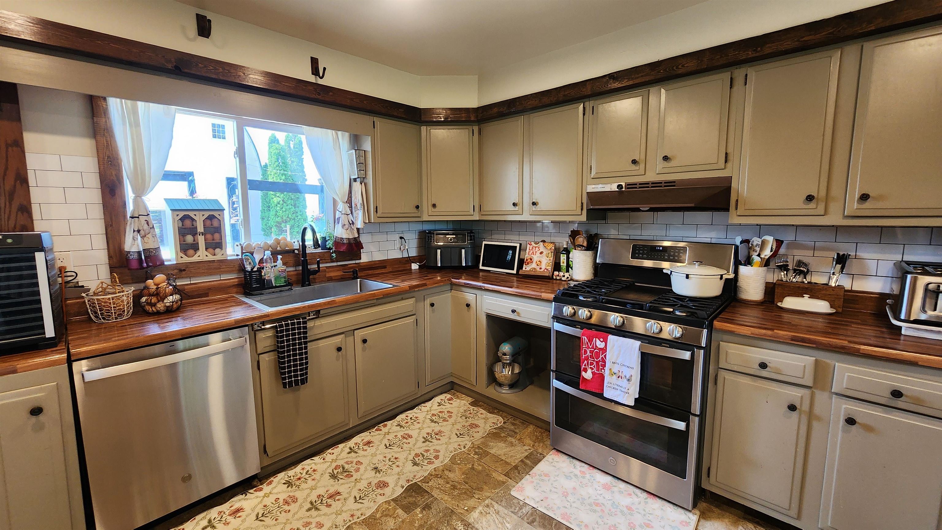 8999 Centerville Road Capron, IL 61012 - Photo 12 of 69 a kitchen with stainless steel appliances granite countertop a sink a stove and cabinets