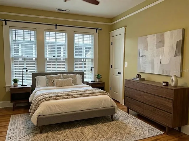 a bedroom with a bed and a dresser