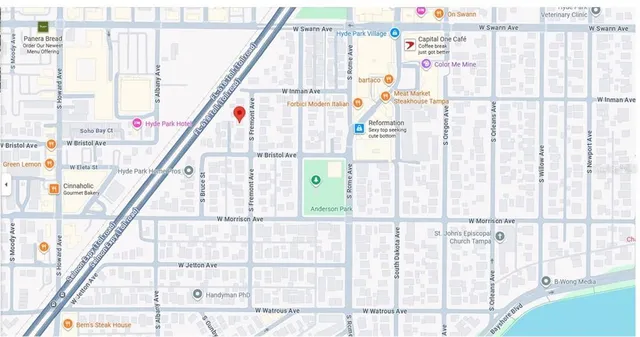 a view of a tree in front of a building