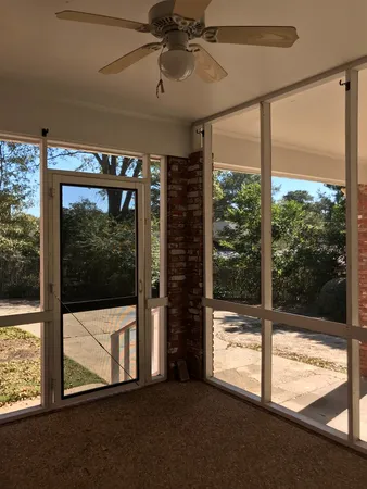 a view of a room with a large window