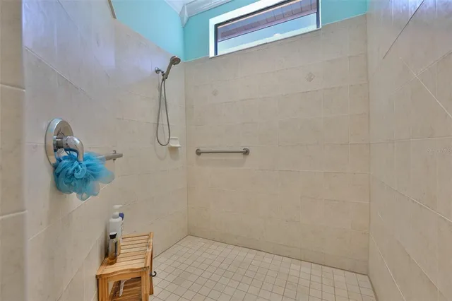 a bedroom with furniture and a flat screen tv