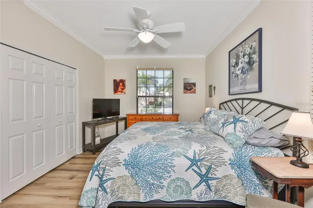 a spacious bathroom with a granite countertop sink a toilet a mirror a vanity and shower