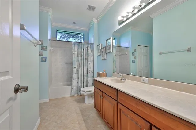 a view of hallway with a large window and wooden floor
